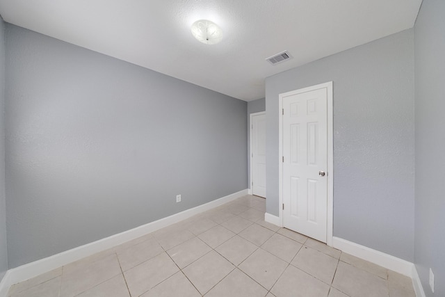 722 Dell Dale St, Channelview, TX 77530 - unfurnished room with light tile patterned floors and baseboards