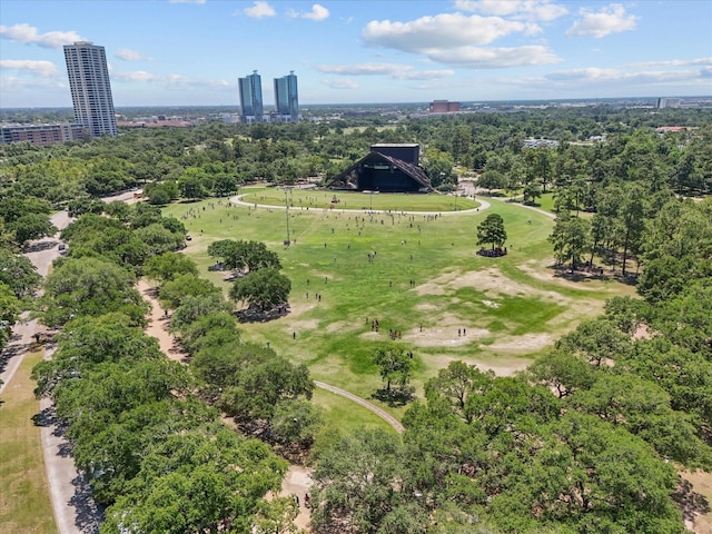 view of urban area with a tree filled landscape
