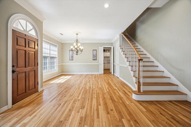 3388 Maroneal St, Houston, TX 77025 - foyer entrance with stairs, crown molding, a chandelier, light wood-style floors, and baseboards