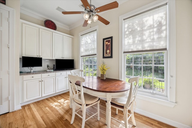 3388 Maroneal St, Houston, TX 77025 - dining room with light wood finished floors, ceiling fan, and ornamental molding