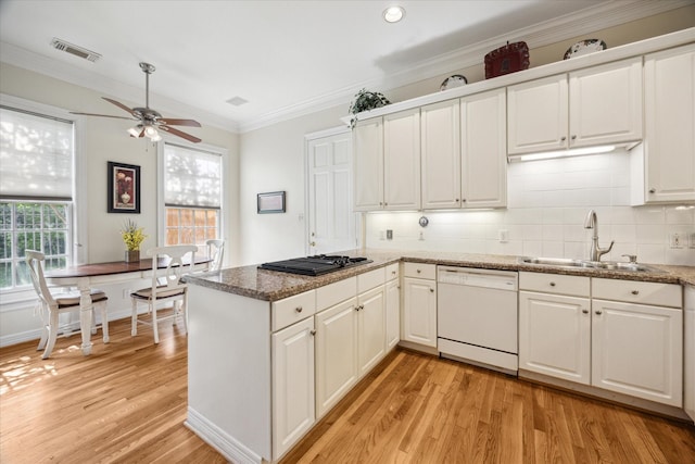 3388 Maroneal St, Houston, TX 77025 - kitchen with white dishwasher, a sink, black stovetop, light wood-style flooring, and a ceiling fan