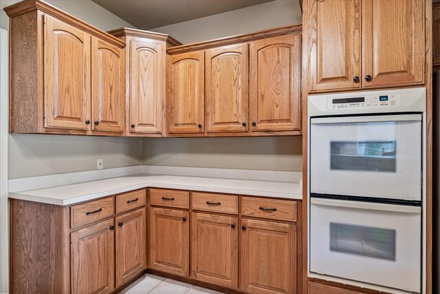 123 June Blvd, Streetman, TX 75859 - kitchen with white double oven and light countertops