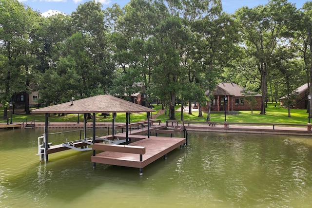 123 June Blvd, Streetman, TX 75859 - dock featuring a water view, boat lift, and view of scattered trees