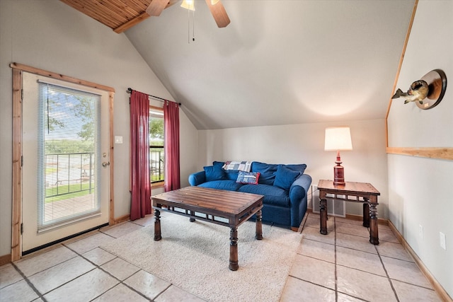 123 June Blvd, Streetman, TX 75859 - living area featuring vaulted ceiling, light tile patterned floors, a ceiling fan, and baseboards