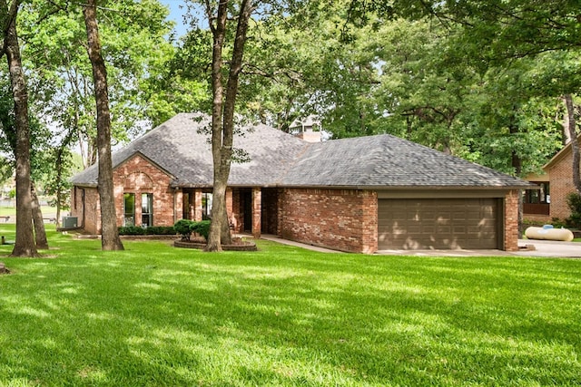 123 June Blvd, Streetman, TX 75859 - ranch-style house featuring a shingled roof, an attached garage, and a front lawn