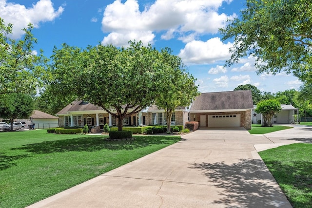 18106 E Cypress Hill Cir, Cypress, TX 77433 - view of front of home with concrete driveway, a garage, a front yard, and brick siding