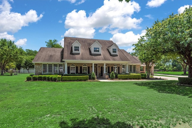 18106 E Cypress Hill Cir, Cypress, TX 77433 - cape cod-style house with brick siding and a porch