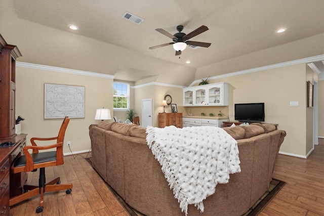 18106 E Cypress Hill Cir, Cypress, TX 77433 - living room with baseboards, a ceiling fan, light wood-type flooring, ornamental molding, and recessed lighting