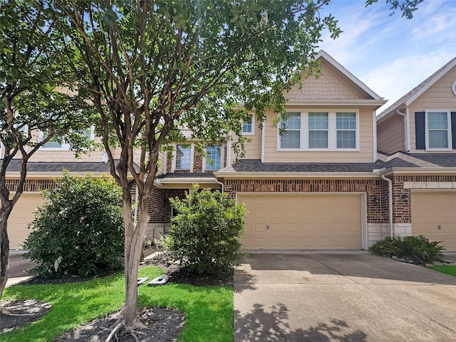 2822 Windy Thicket Ln, Houston, TX 77082 - view of property with an attached garage, concrete driveway, brick siding, and roof with shingles