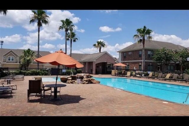2822 Windy Thicket Ln, Houston, TX 77082 - community pool with a patio area and fence