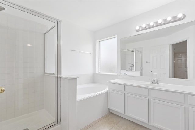 6414 Windmist Cir, Houston, TX 77084 - bathroom featuring a stall shower, a bath, tile patterned flooring, and vanity