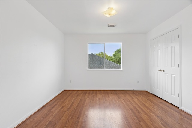 6414 Windmist Cir, Houston, TX 77084 - unfurnished bedroom featuring wood finished floors, baseboards, and a closet