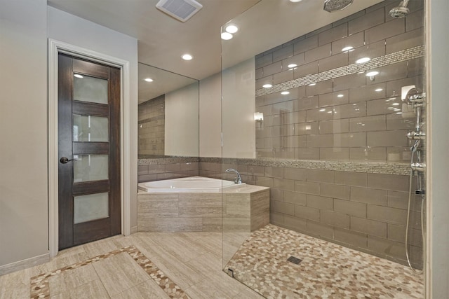 full bathroom with tiled shower, a garden tub, inlaid floor details, and recessed lighting