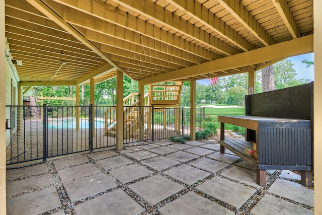 view of patio featuring fence and a playground