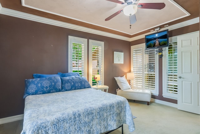 10022 Jan Glen Ln, Houston, TX 77070 - bedroom with carpet, baseboards, ornamental molding, a tray ceiling, and a ceiling fan
