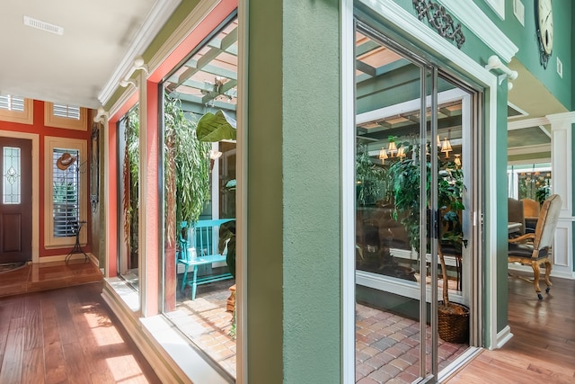 10022 Jan Glen Ln, Houston, TX 77070 - entryway with ornamental molding, wood-type flooring, and a textured wall