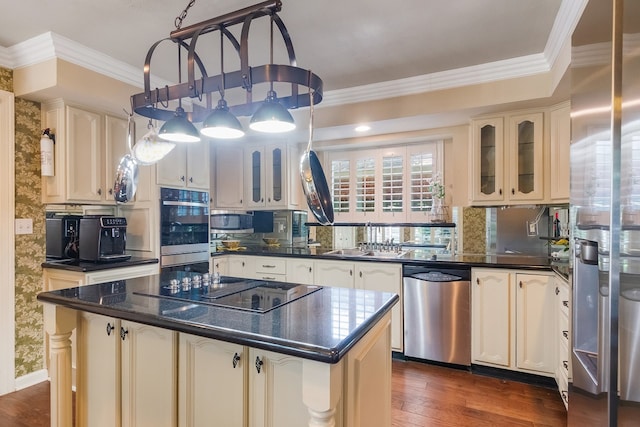 10022 Jan Glen Ln, Houston, TX 77070 - kitchen featuring stainless steel appliances, dark countertops, a sink, and ornamental molding