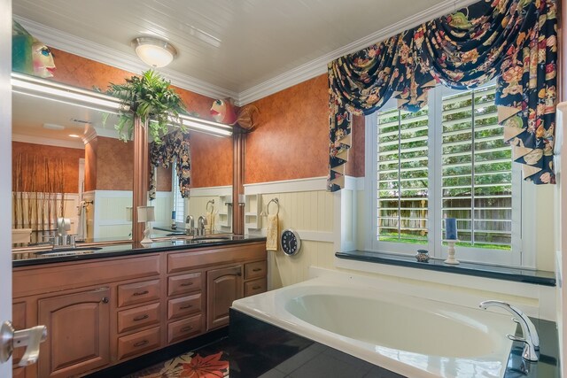 10022 Jan Glen Ln, Houston, TX 77070 - bathroom featuring double vanity, a garden tub, a wainscoted wall, and ornamental molding