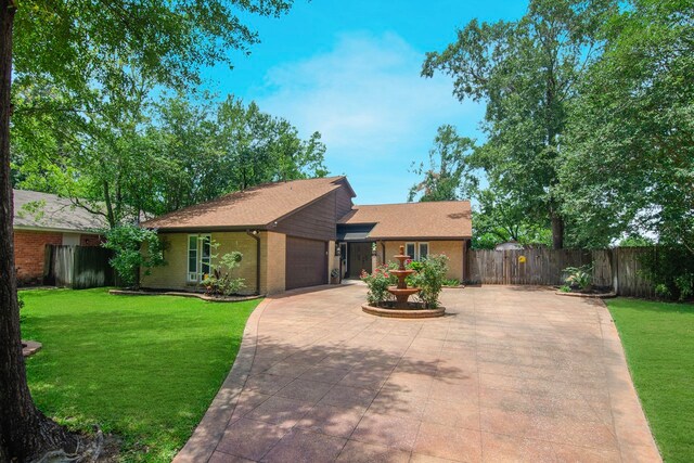 10022 Jan Glen Ln, Houston, TX 77070 - view of front facade with concrete driveway, a garage, and brick siding
