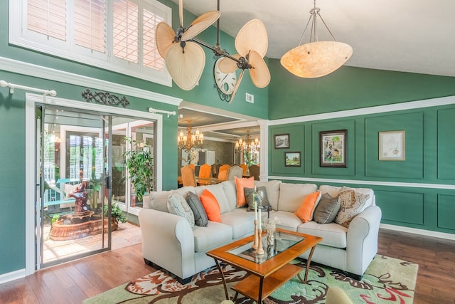 10022 Jan Glen Ln, Houston, TX 77070 - living room with high vaulted ceiling, a chandelier, and wood finished floors