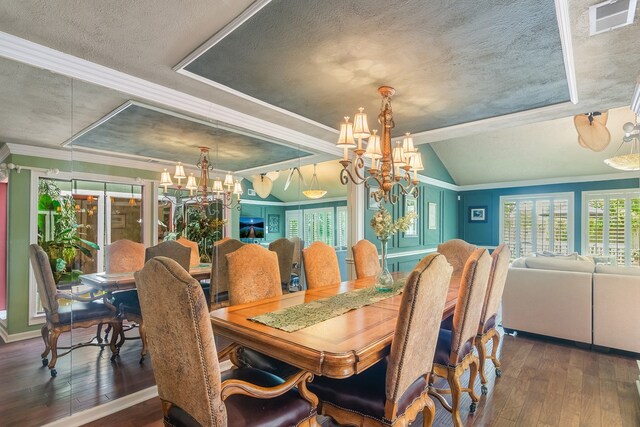 10022 Jan Glen Ln, Houston, TX 77070 - dining room with a chandelier, crown molding, hardwood / wood-style floors, a textured ceiling, and lofted ceiling