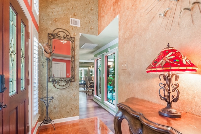 10022 Jan Glen Ln, Houston, TX 77070 - foyer entrance featuring baseboards, crown molding, and wallpapered walls