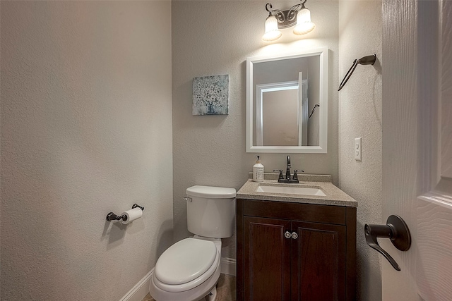 618 Santa Elena Cyn, Spring, TX 77388 - bathroom featuring toilet, vanity, and a textured wall