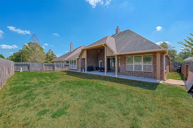 618 Santa Elena Cyn, Spring, TX 77388 - rear view of property with brick siding, a patio, a chimney, and roof with shingles