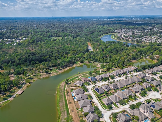618 Santa Elena Cyn, Spring, TX 77388 - view of property location featuring a heavily wooded area, nearby suburban area, and a large body of water