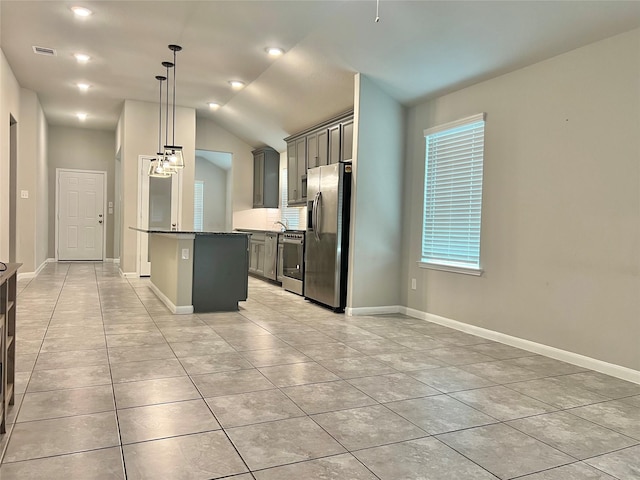 2338 Vanessa Cay Ln, La Porte, TX 77571 - kitchen with stainless steel refrigerator with ice dispenser, dishwasher, light tile patterned floors, vaulted ceiling, and baseboards