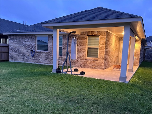 2338 Vanessa Cay Ln, La Porte, TX 77571 - rear view of house with brick siding, a patio, and a shingled roof