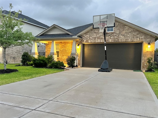 2338 Vanessa Cay Ln, La Porte, TX 77571 - craftsman house with brick siding, driveway, an attached garage, and a front yard