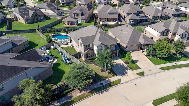 aerial view of residential area featuring a pool area