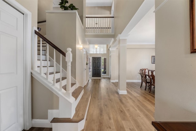 17326 Meadow Heights Dr, Houston, TX 77095 - foyer entrance featuring baseboards, wood finished floors, stairway, ornate columns, and ornamental molding
