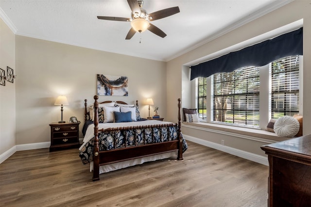17326 Meadow Heights Dr, Houston, TX 77095 - bedroom with crown molding, wood finished floors, baseboards, and a ceiling fan