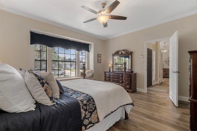 17326 Meadow Heights Dr, Houston, TX 77095 - bedroom with ornamental molding, light wood finished floors, baseboards, and ceiling fan
