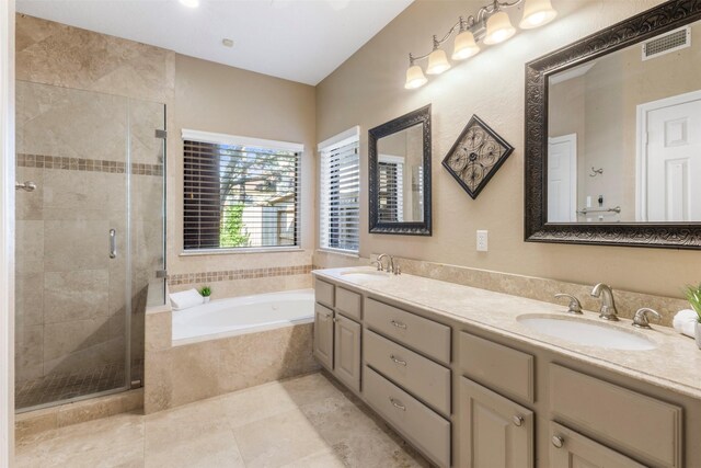 17326 Meadow Heights Dr, Houston, TX 77095 - full bathroom featuring a bath, a shower stall, double vanity, and tile patterned flooring