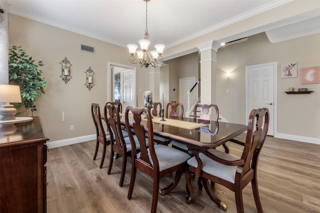 17326 Meadow Heights Dr, Houston, TX 77095 - dining room with ornamental molding, light wood-type flooring, a chandelier, baseboards, and ornate columns