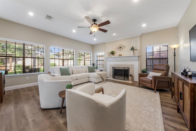 17326 Meadow Heights Dr, Houston, TX 77095 - living area featuring ceiling fan, dark wood-style flooring, a fireplace, baseboards, and recessed lighting