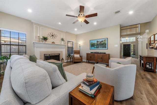 17326 Meadow Heights Dr, Houston, TX 77095 - living room with wood finished floors, a ceiling fan, recessed lighting, and a tile fireplace