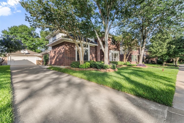 17326 Meadow Heights Dr, Houston, TX 77095 - view of front of property featuring brick siding, an outbuilding, a garage, a front yard, and driveway