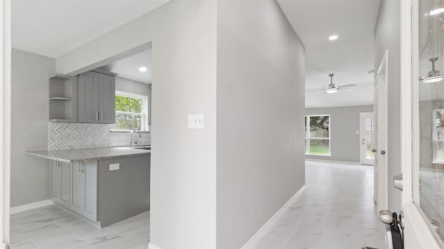 4007 Green Crest Dr, Houston, TX 77082 - hallway featuring light marble finish flooring, baseboards, and recessed lighting