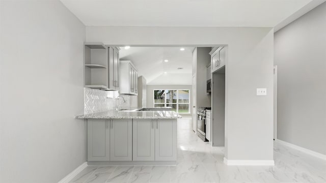 4007 Green Crest Dr, Houston, TX 77082 - kitchen with open shelves, appliances with stainless steel finishes, gray cabinetry, a peninsula, and light stone counters