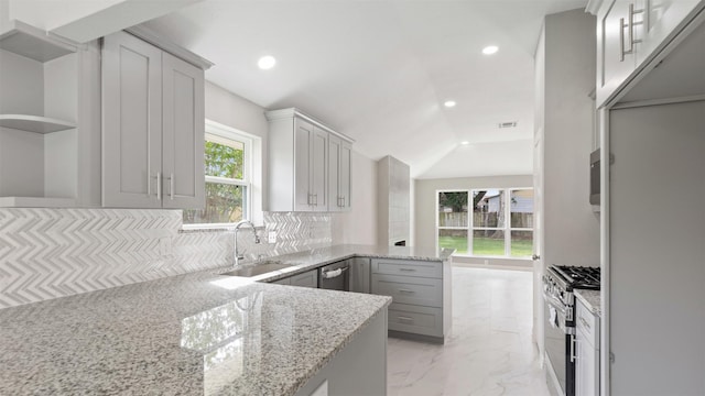 4007 Green Crest Dr, Houston, TX 77082 - kitchen featuring appliances with stainless steel finishes, open shelves, a sink, a peninsula, and recessed lighting
