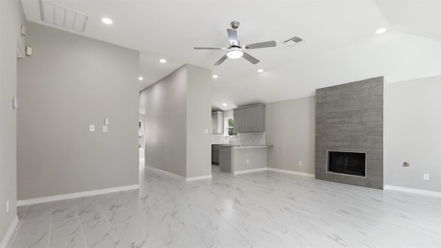4007 Green Crest Dr, Houston, TX 77082 - unfurnished living room with a ceiling fan, light marble finish flooring, a fireplace, lofted ceiling, and baseboards