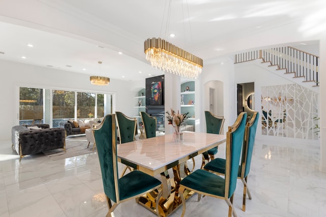 dining area with a chandelier, light marble finish floors, recessed lighting, stairs, and built in shelves