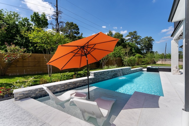 view of swimming pool featuring a fenced backyard and a patio area
