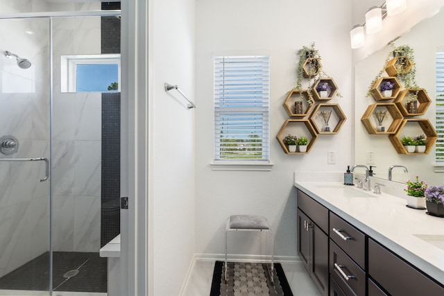 bathroom with baseboards, double vanity, and a shower stall