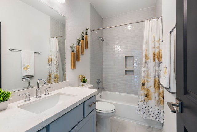 full bathroom featuring shower / tub combo with curtain, toilet, and vanity