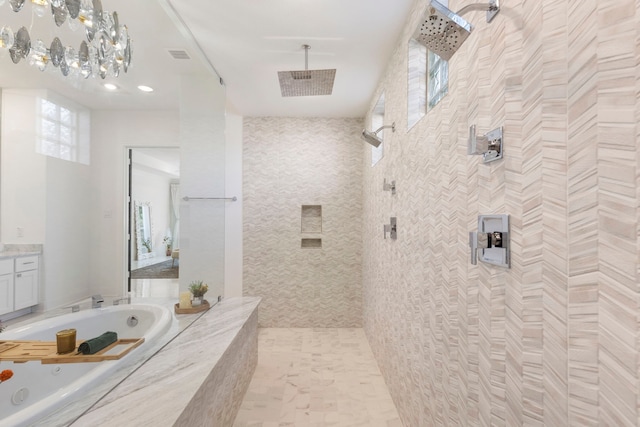 bathroom with a bath, tiled shower, and vanity